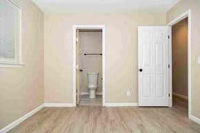 Fenton house for rent - an empty room with a toilet and a door to a bathroom