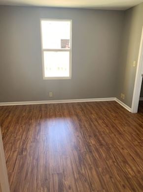 Dodge City apartment for rent - A room with a wooden floor and a window.