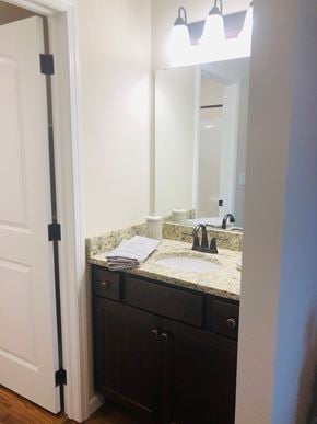 Dodge City apartment for rent - A bathroom with a sink and a mirror.