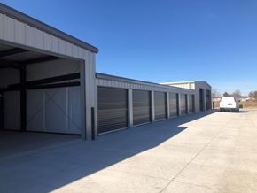 Dodge City apartment for rent - A long row of closed grey garage doors.