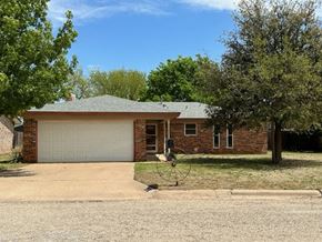 Snyder house for rent - a small brick house with a white garage door