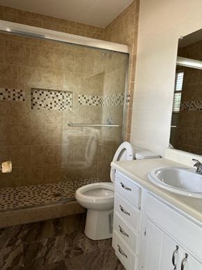 Snyder house for rent - a bathroom with a toilet and a sink and a shower
