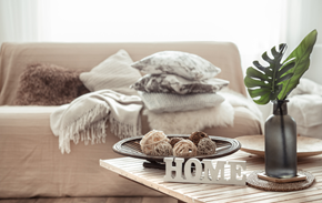 Sault Ste Marie apartment for rent - a coffee table with a plate of cookies on it on a couch with pillows