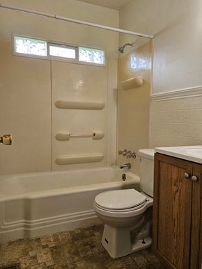 Youngstown house for rent - a bathroom with a toilet and a bath tub