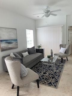 Casselberry apartment for rent - A living room with a grey couch, a chair and a coffee table.