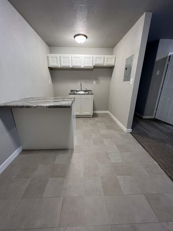 Dilworth apartment for rent - A kitchen with a sink and a counter.