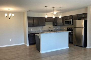 Newburgh apartment for rent - a kitchen with an island and stainless steel refrigerator