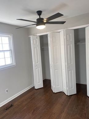 Rock Hill house for rent - an empty bedroom with a ceiling fan and a closet