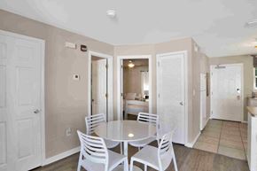 Orange Beach house for rent - a dining room with a table and chairs