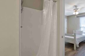 Orange Beach house for rent - a bedroom with a bed and a ceiling fan