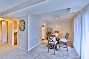 Reisterstown apartment for rent - a dining room with a wooden table and chairs