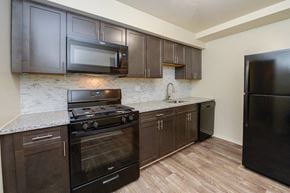 Reisterstown apartment for rent - a kitchen with a stove and a microwave