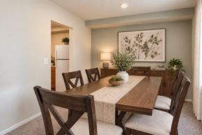 Reisterstown apartment for rent - A dining room with a wooden table and chairs.