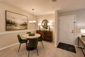 Owings Mills apartment for rent - A dining room with a round table and chairs.
