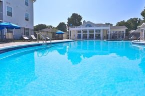 Owings Mills apartment for rent - a large swimming pool with a building in the background