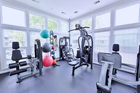 Owings Mills apartment for rent - a gym with cardio equipment and windows in a building