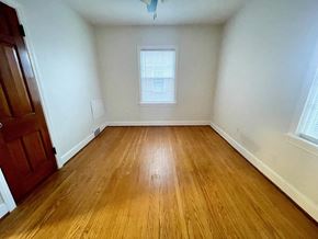 Louisville apartment for rent - A room with wooden flooring and a window.