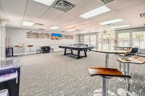 Bear townhouse for rent - a game room with a pool table and tables