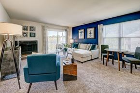 Bear townhouse for rent - a living room with a blue accent wall and a fireplace