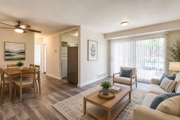Glen Burnie apartment for rent - A living room with a dining table and chairs.