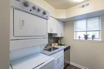 Glen Burnie apartment for rent - a white kitchen with a stove and a sink