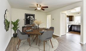 Glen Burnie apartment for rent - a dining room with a table and chairs and a ceiling fan