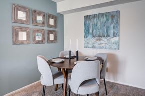 Miamisburg apartment for rent - a dining room with a table and chairs