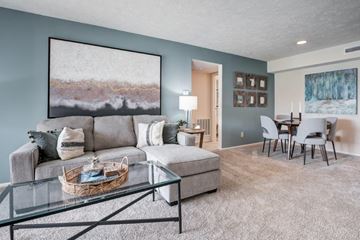 Miamisburg apartment for rent - a living room and dining room with a couch and a table
