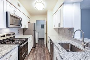 Miamisburg apartment for rent - a kitchen with granite counter tops and stainless steel appliances