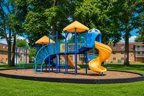 Lansdale apartment for rent - A playground with a blue and yellow slide and a yellow and blue tower.