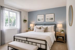 Lansdale apartment for rent - A bedroom with a large bed and a window with curtains.