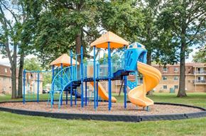 Lansdale apartment for rent - a playground with a blue and yellow slide in a park