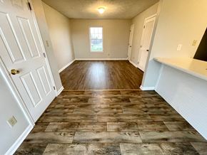 Mt. Washington apartment for rent - an empty living room and hallway with wood flooring