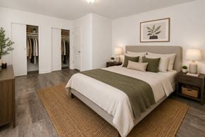 Baltimore apartment for rent - A bedroom with a large bed and a wardrobe.