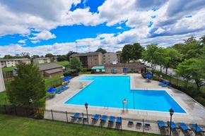 Laurel apartment for rent - an aerial view of a large swimming pool with chairs around it