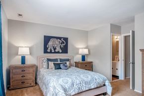 Moorestown apartment for rent - a bedroom with a bed and a painting of an elephant
