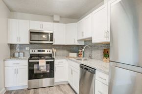 Plymouth Meeting apartment for rent - a kitchen with stainless steel appliances and white cabinets