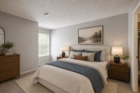 Stafford apartment for rent - A bedroom with a bed, two nightstands, and a painting on the wall.