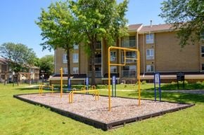 Omaha apartment for rent - a playground in front of an apartment building
