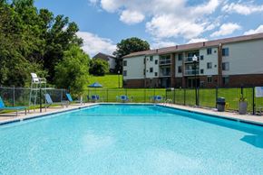 Baltimore apartment for rent - a swimming pool with an apartment building in the background