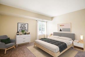 Baltimore apartment for rent - a bedroom with a bed and a dresser and a window