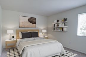 South Park apartment for rent - A bedroom with a large bed and a painting on the wall.