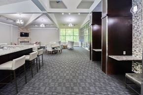 East Norriton apartment for rent - a dining room with tables and chairs and a bar