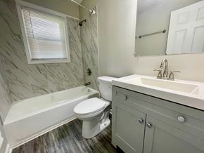 Louisville house for rent - a bathroom with a sink toilet and a bath tub