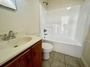 Corydon apartment for rent - a bathroom with a sink toilet and a tub