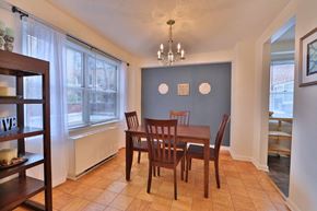 Baltimore apartment for rent - a dining room with a wooden table and chairs