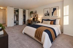 Baltimore apartment for rent - A bedroom with a large bed and a wardrobe.