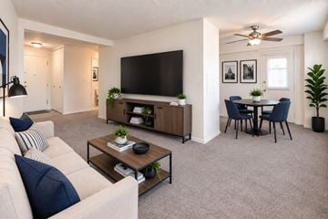 Baltimore apartment for rent - A living room with a white couch and a television.
