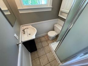 Jeffersonville apartment for rent - a small bathroom with a sink toilet and shower