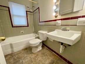 Louisville apartment for rent - A bathroom with a white toilet and sink.